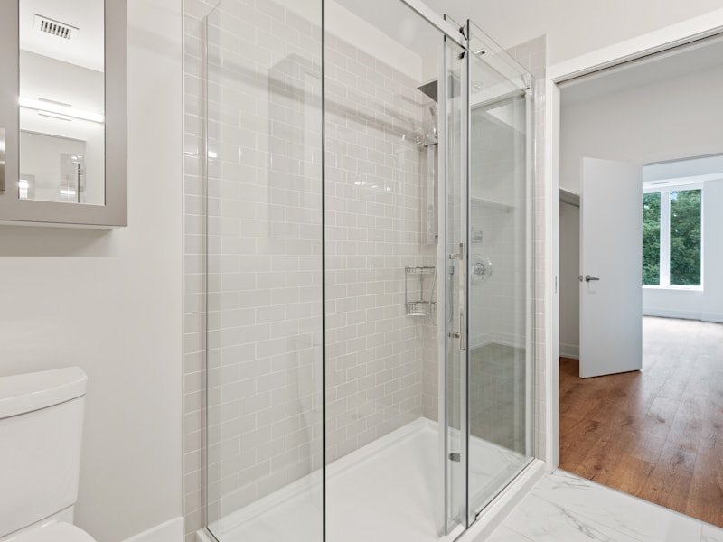 Semi-frameless bypass enclosure with white subway tile